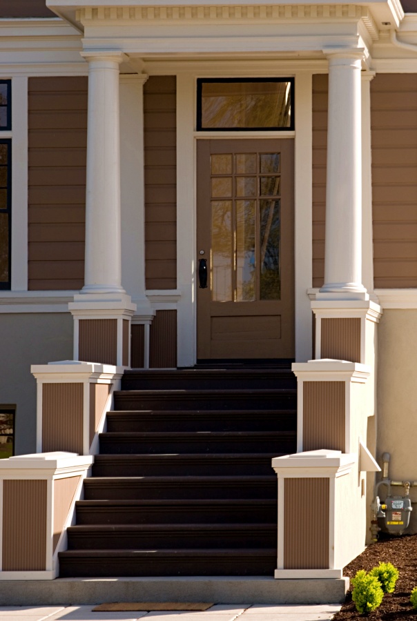 A grand entrance to a refurbished craftsman style home.