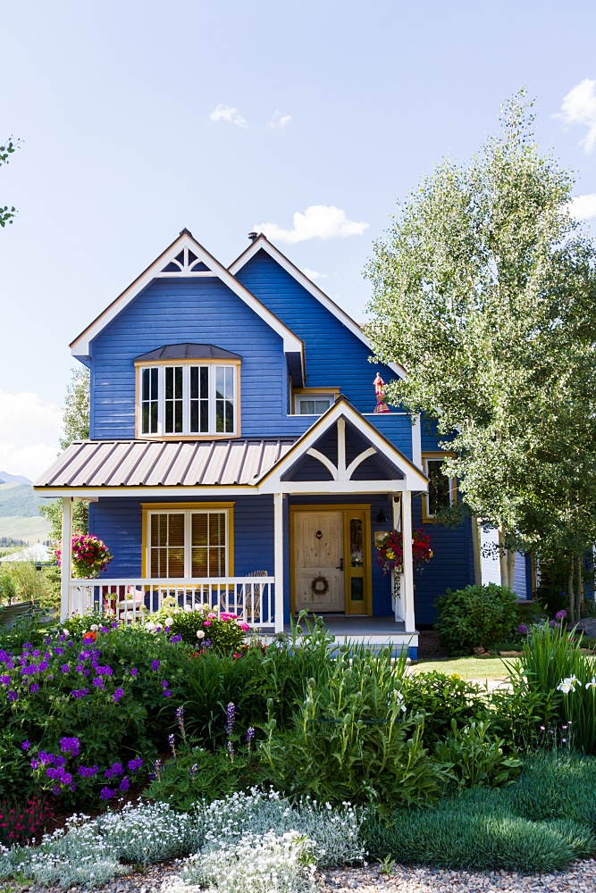 Blue Victorian home with plenty of curb appeal