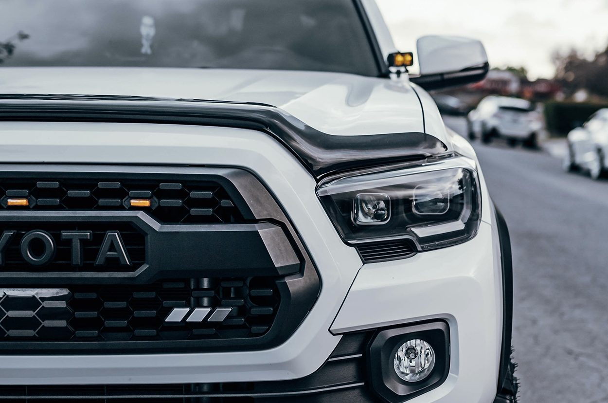 Black Housing Spyder Headlights on White 3rd Gen Toyota Tacoma