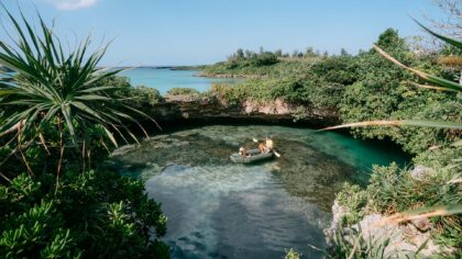 Two people sea cave kayaking in Okinawa, Japan