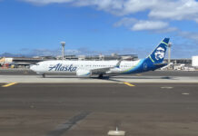 a white airplane on a runway