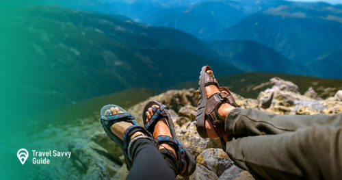 people in sandals on a mountain cliff