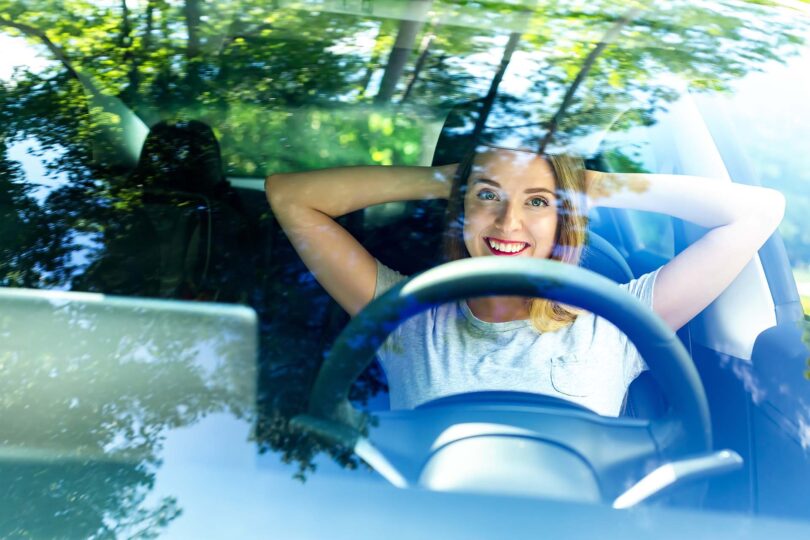 Young woman in a self-driving autonomous electric car