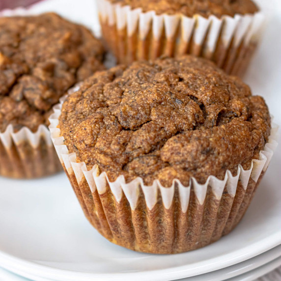 Pumpkin banana muffins on a white plate