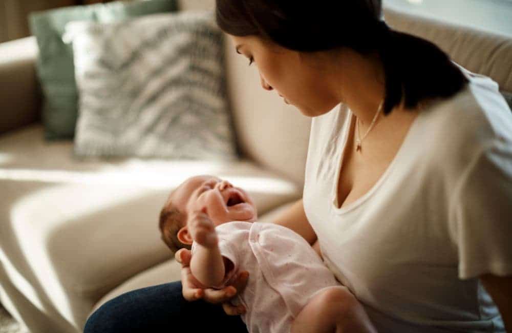 mom comforting crying baby