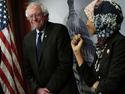 Rep. Ilhan Omar and Sen. Bernie Sanders share a moment during a news conference, January 10, 2019, at the Capitol in Washington, D.C.