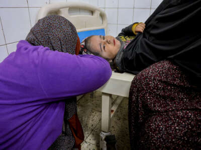 A child receives medical attention at Al-Ma'amadani Hospital in Jabalia al-Balad, north of the Gaza Strip, January 4, 2025.