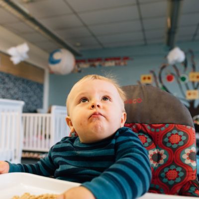 Picture: A young baby looks up at the camera.