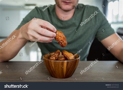 Man Eating Korean Spicy Chicken Wings Stock Photo 1417110134 | Shutterstock