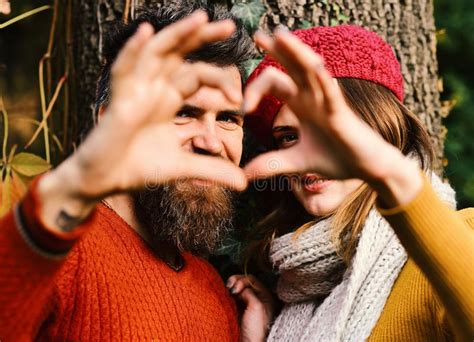 Couple in Love Shows Heart Sign with Fingers. Stock Photo - Image of ...