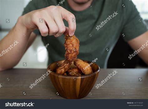 Man Eating Korean Spicy Chicken Wings Stock Photo 1417110137 | Shutterstock