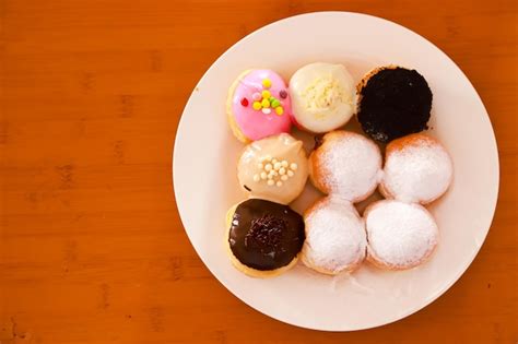 Premium Photo | Mini donuts with various flavors and variants served on ...