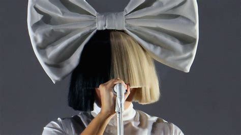 Why Does Sia Cover Her Face With a Wig? Here’s the Answer | Allure