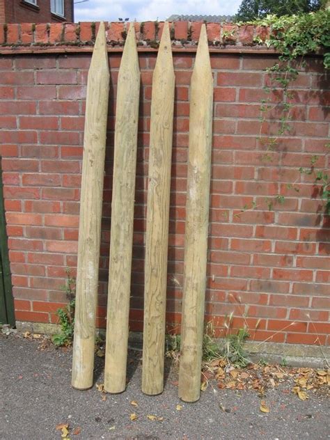 12 Half round wooden treated fencing posts | in Norwich, Norfolk | Gumtree