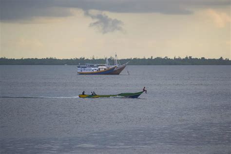 Sorong, West Papua, Indonesia, September 30th 2021. The villagers cross ...