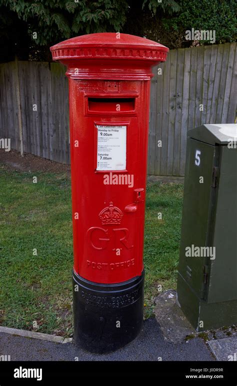 A red post office letter box Stock Photo - Alamy