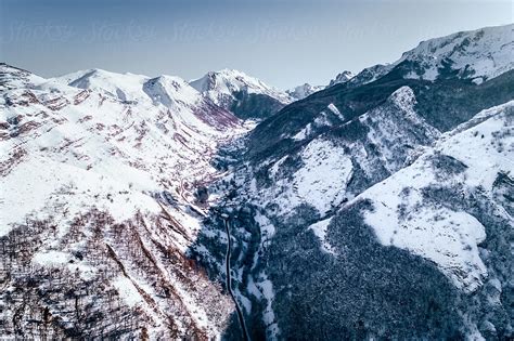 "Snowy Mountains Landscape" by Stocksy Contributor "Marco Govel" - Stocksy