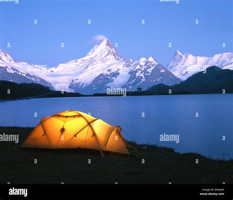 Switzerland Bachalpsee lake scenery camping tent lights up mountain ...