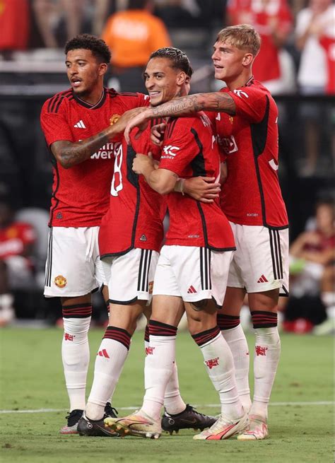 the soccer players are congratulating each other on their team's first goal