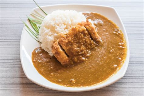 Premium Photo | Fried pork with curry rice