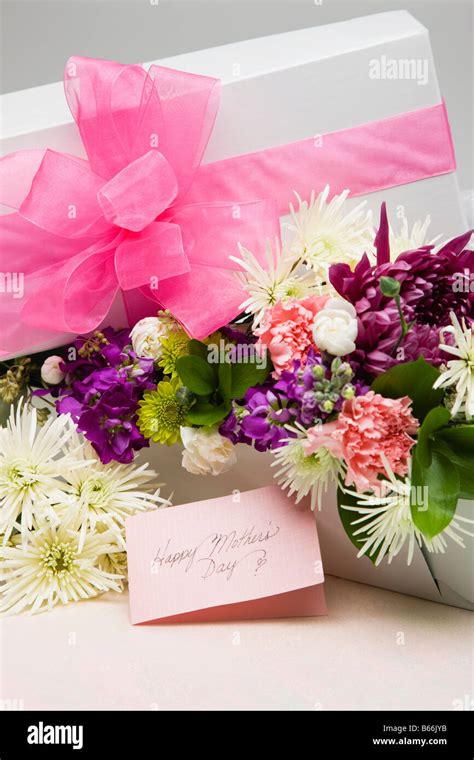 Mother's Day flowers with card and gift Stock Photo - Alamy