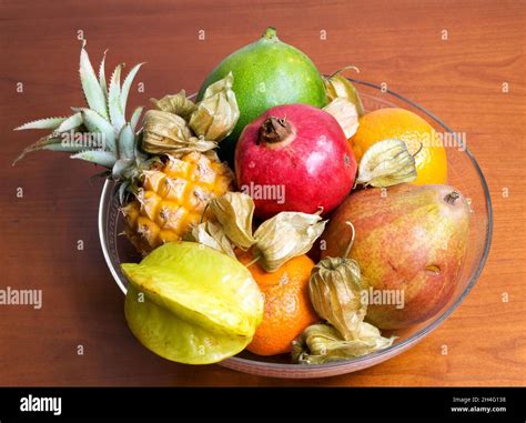 Glass bowl with exotic fruits Stock Photo - Alamy