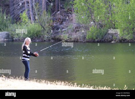 Fishing at the lake Stock Photo - Alamy