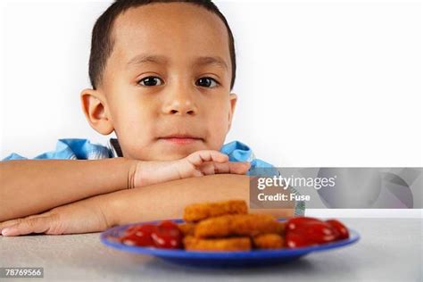 18 Boy Eating Chicken Nuggets Stock Photos, High-Res Pictures, and ...