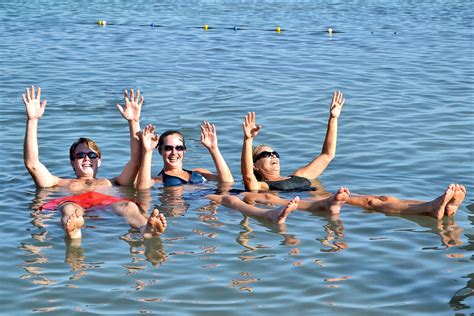 Floating in Dead Sea in Israel - Encircle Photos