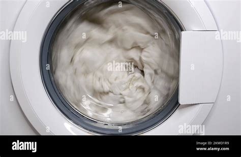 washing clothes in a washing machine Stock Video Footage - Alamy