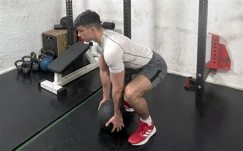 Medicine Ball Slam Guide: How To, Muscles Worked, Benefits, Alternatives