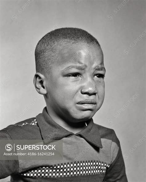 1940s 1950s PORTRAIT OF SAD YOUNG AFRICAN-AMERICAN BOY ABOUT TO BEGIN ...