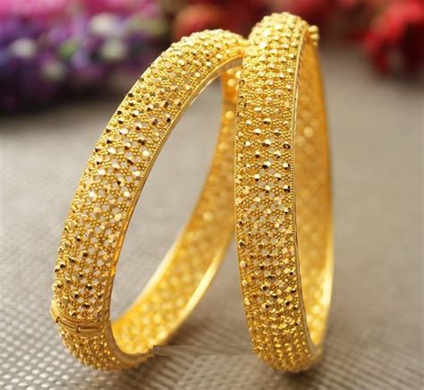 Latest Bangle Designs in Gold - Dhanalakshmi Jewellers