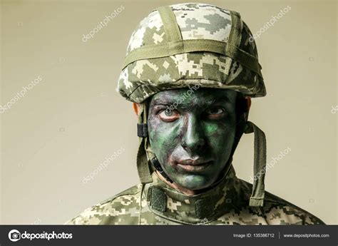 Soldier Face Paint Grey Background Stock Photo by ©belchonock 135386712