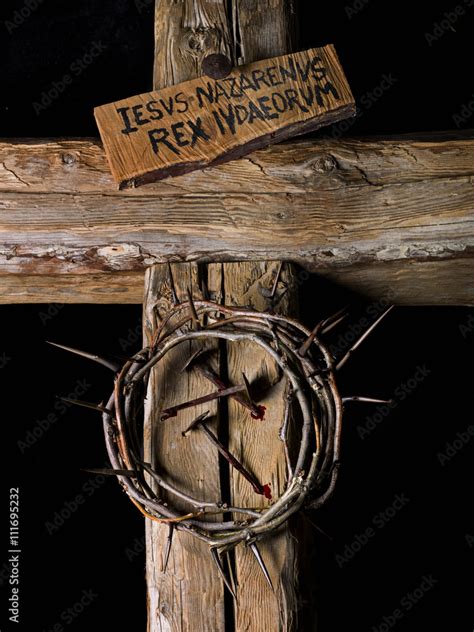 Crown of thorns and nails of Christ with blood on wooden cross Stock ...