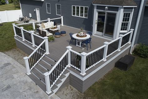 Transform Your Outdoor Space with a Stunning Tan Deck and Black Railing ...