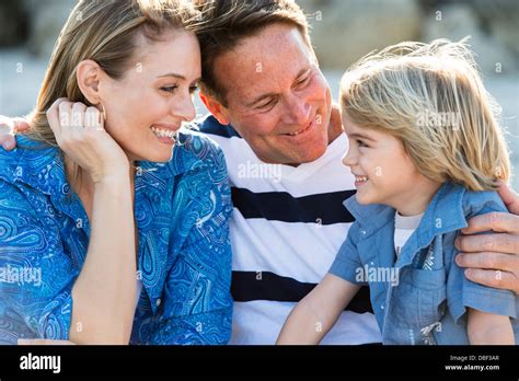 Family smiling together outdoors Stock Photo - Alamy