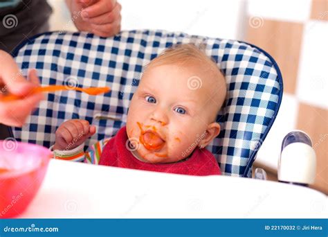 Feeding baby food to baby stock photo. Image of child - 22170032