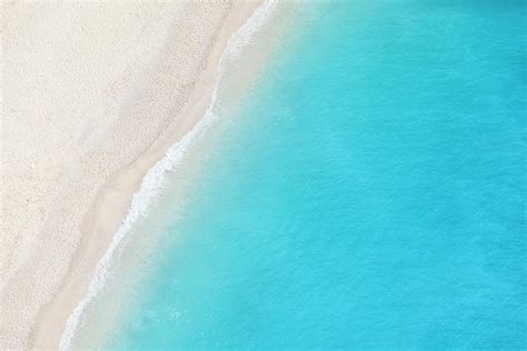 A Birds Eye View Of A White Sandy Beach by Tadejzupancic