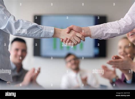 Business womans handshake Stock Photo - Alamy