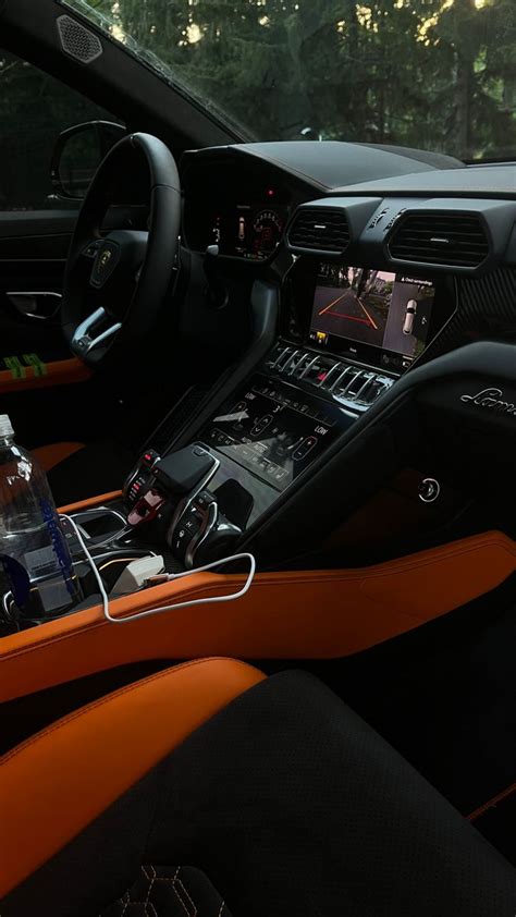 Lamborghini Urus Interior with Orange Trim and Black Leather Seats