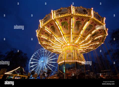 A Carousel and Ferris Wheel at Winter Wonderland, London Stock Photo ...