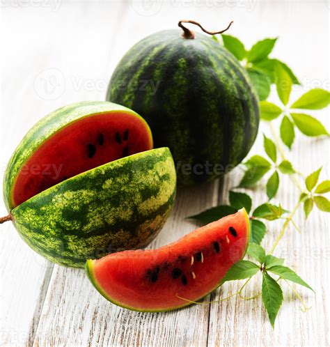 Watermelon with green leaves 4898640 Stock Photo at Vecteezy