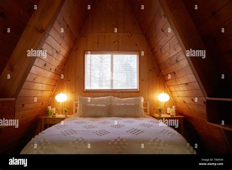 Bedroom in A-frame house Stock Photo - Alamy