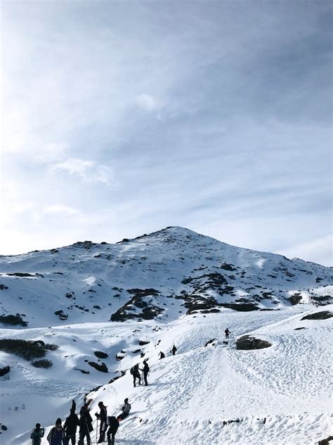 People Hiking in Snowy Mountains · Free Stock Photo