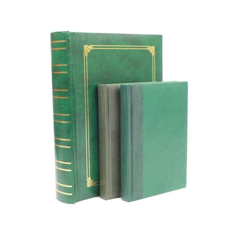 Green leather book cover with gold pattern isolated on white bac ...