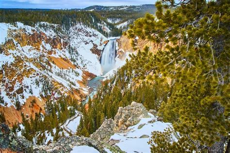 Premium Photo | Beautiful upper falls at yellowstone in winter from ...