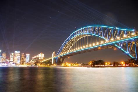 Premium Photo | Sydney harbour bridge with blue lights during vivid ...