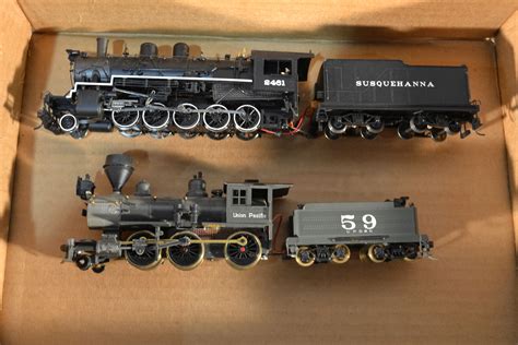 Two HO scale steam locomotives and cars