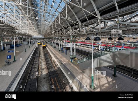 The inside of Manchester Piccadilly railway train station on a sunny ...